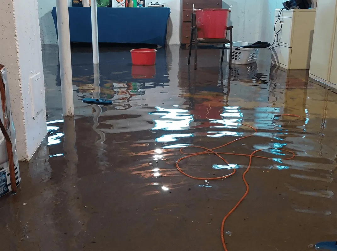 Basement with boiler, cabinets and washing machine completely flooded in South Bend, IN